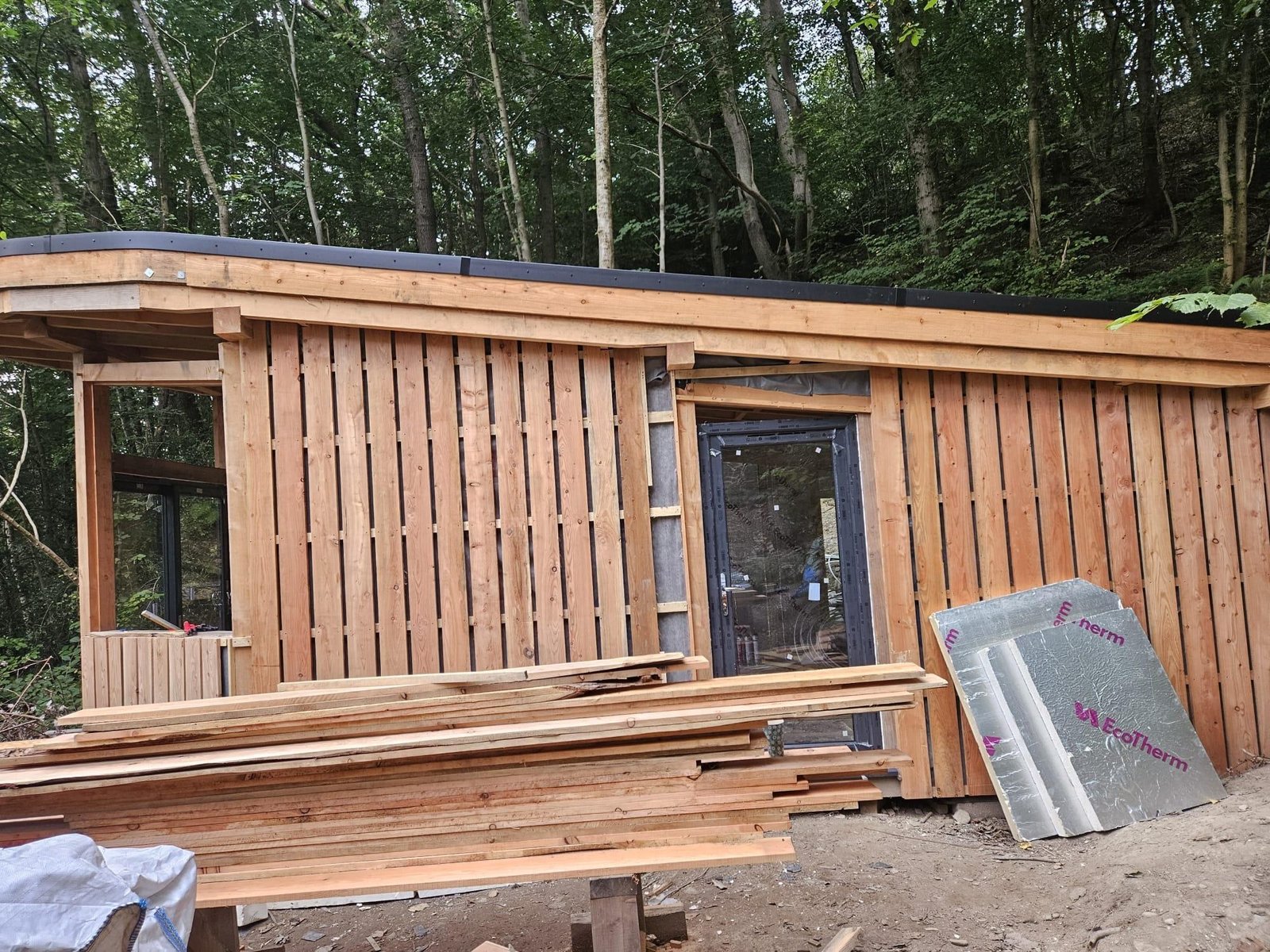 The Toad Hideout woodland cabin under construction using timber at Tree Tops and Train Tracks in North Wales