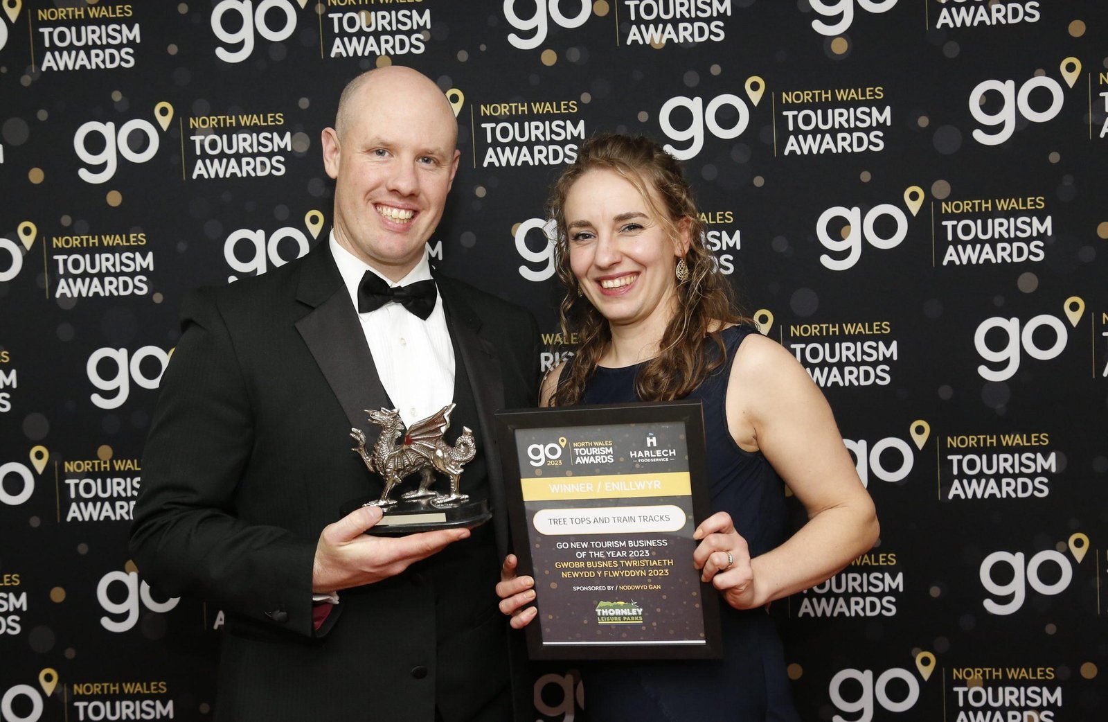 Tree Tops and Train Tracks celebrating winning New Tourism Business of the Year at the 2023 North Wales Tourism Awards